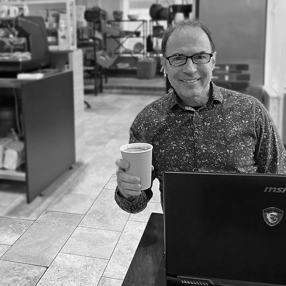 Neil enjoying a nice Americano while focusing on the morning's deep work.
