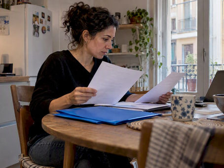 Expat comparing therapy insurance policy papers