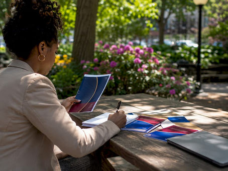 Woman reading mental health resource pamphlet