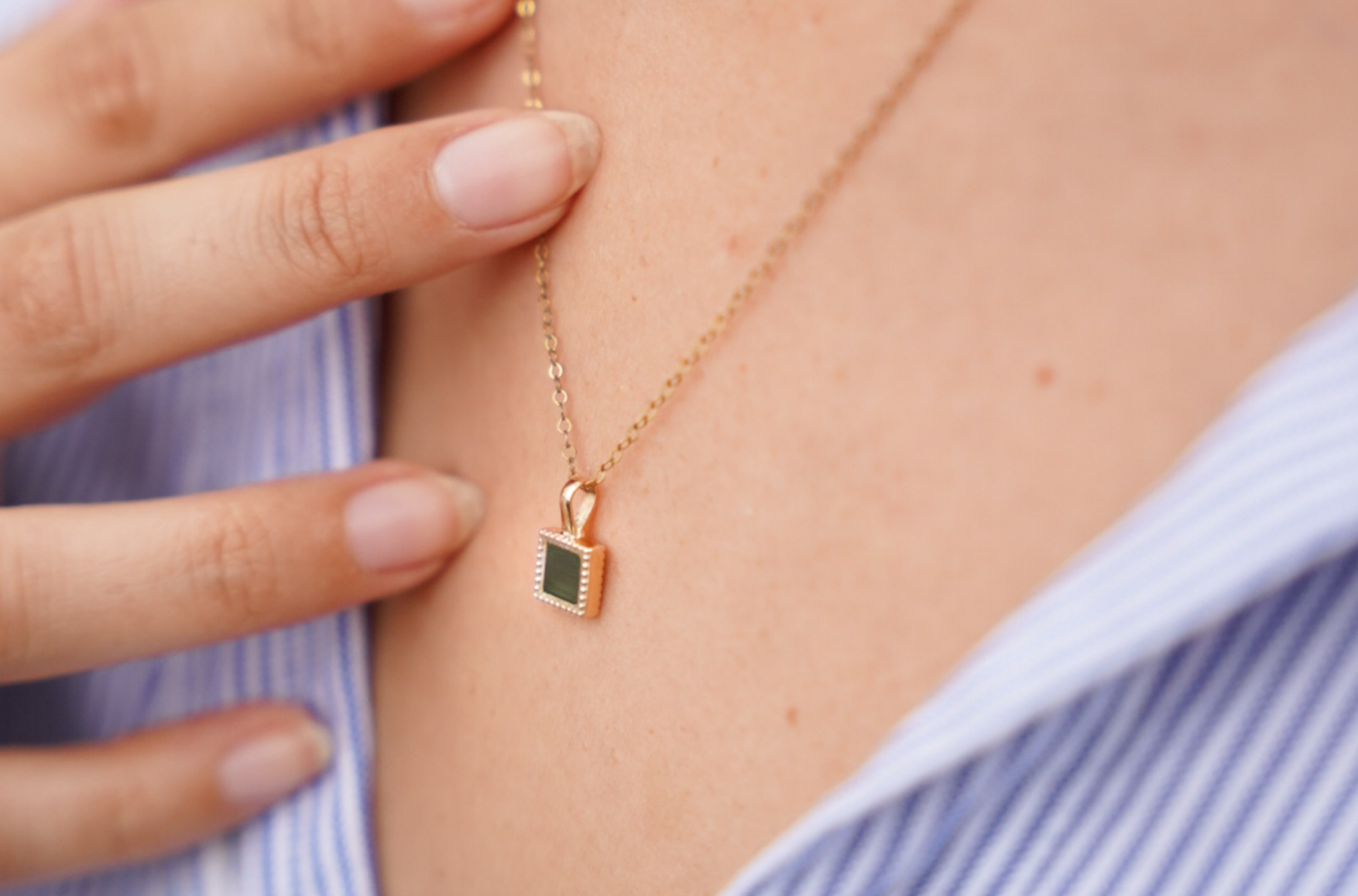 Squar pendant is made of 14K gold and  embedded with Nano Bible  New Testament and Old Testamenet sims, on the neck