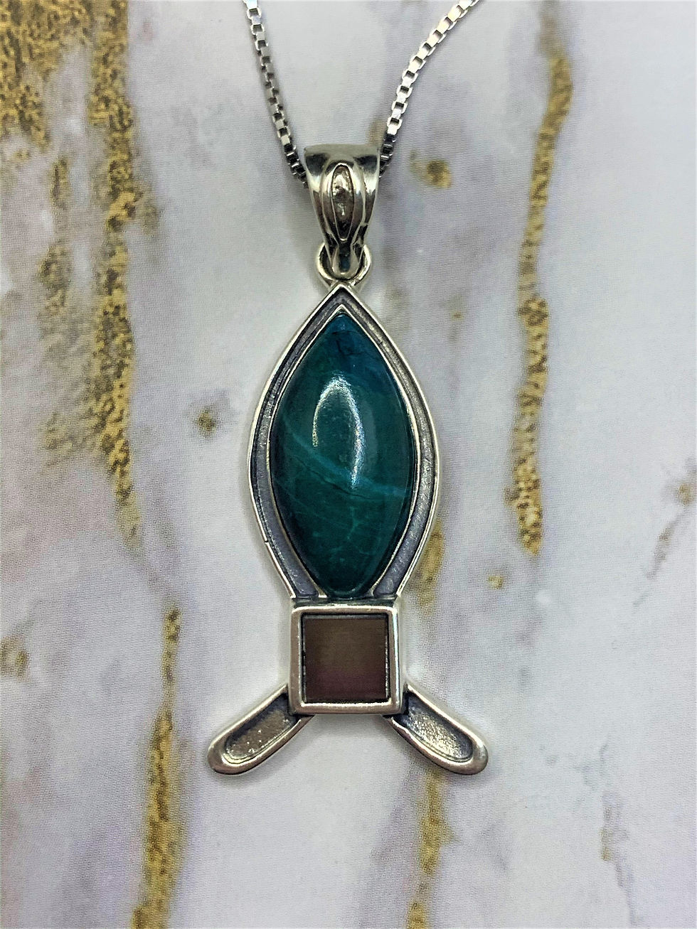 Thumbnail: Fish pendant with New testament Nano Bible sim, Eilat stone on marble