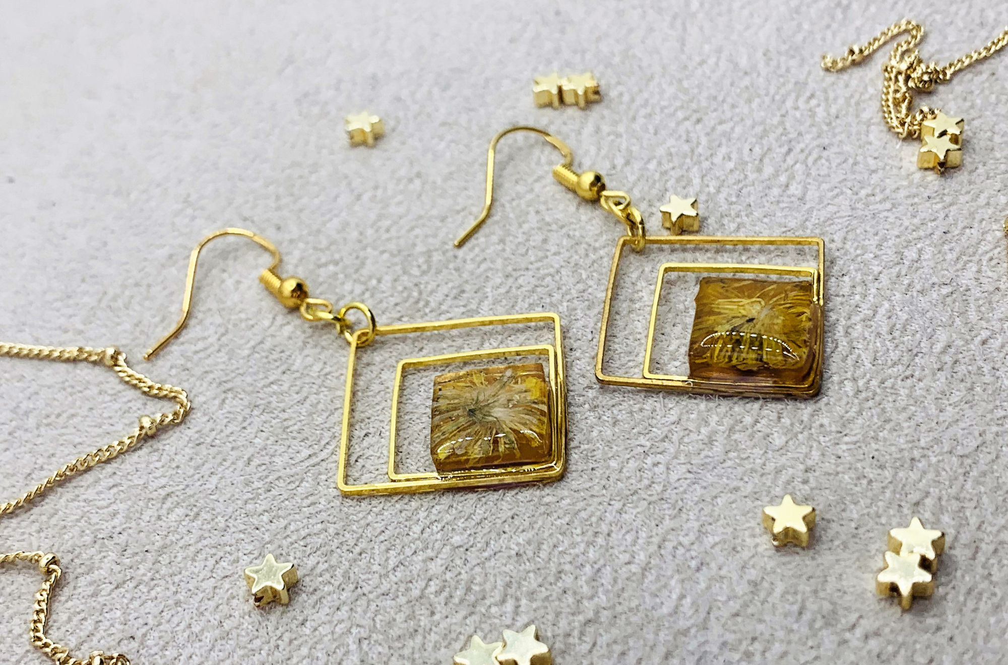 Christian jewelry, Gold plated dangle handmade earrings with dried flowers from the Holy Land front view