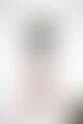 little girl looking out window of white house smiling at over the vines in edgerton wisconsin