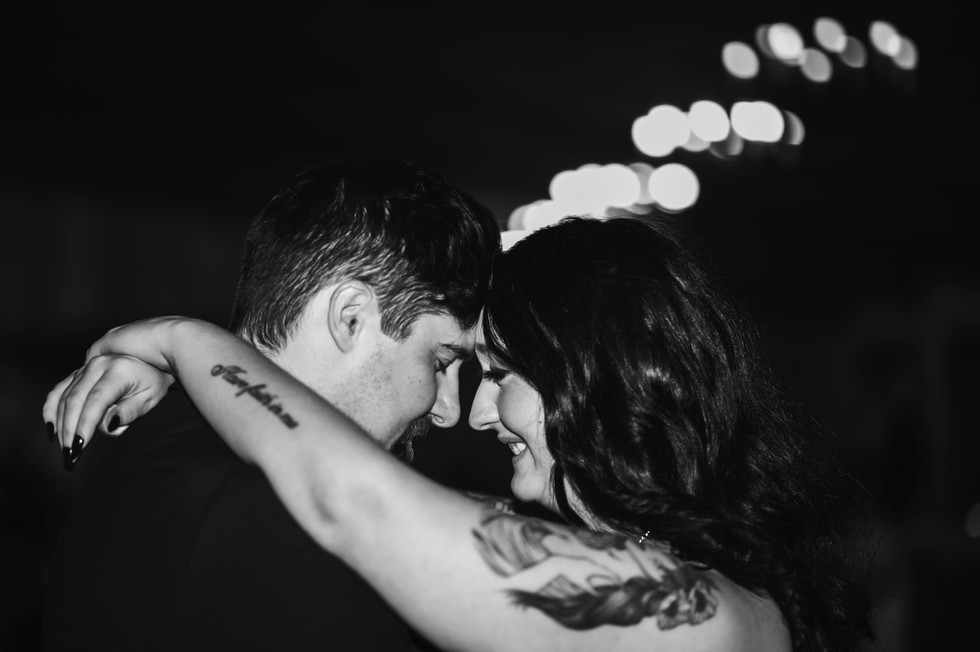 bride and groom head to head smiling during their first dance at Whispering Pines Event Center in Poynette Wisconsin