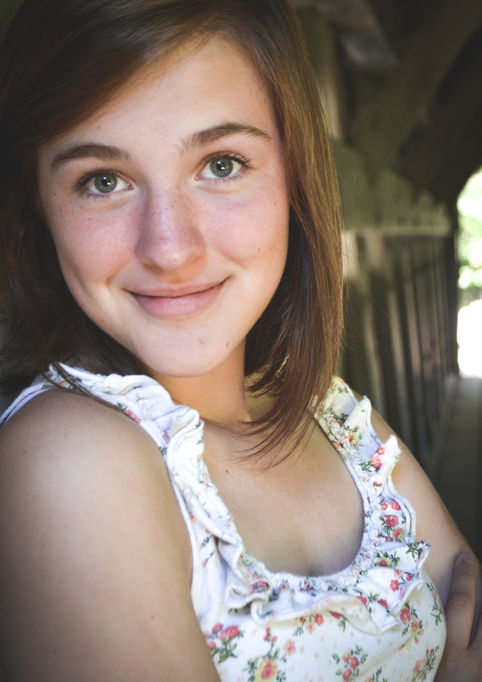 close up of teenage girls face smiling brown hair
