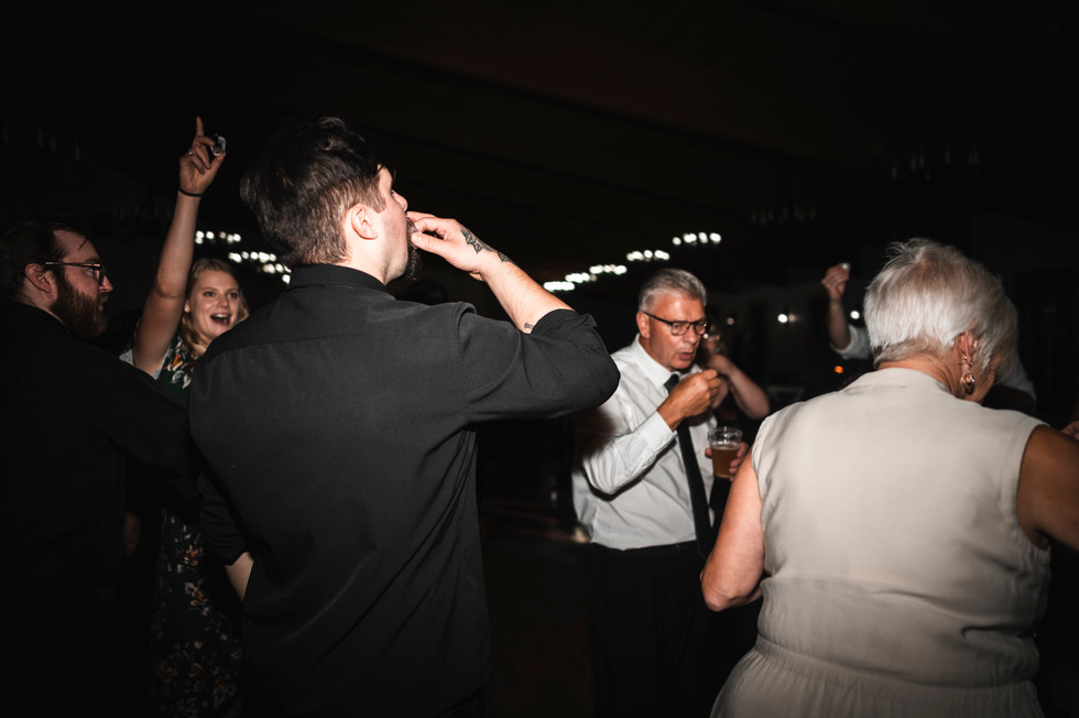 groom taking shot on the dance floor at Whispering Pines Event Center in Poynette Wisconsin