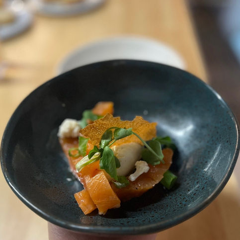 Trout gravlax served with anise and lemon cream.