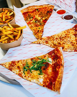 Slices of Delicious Pizza and Fries