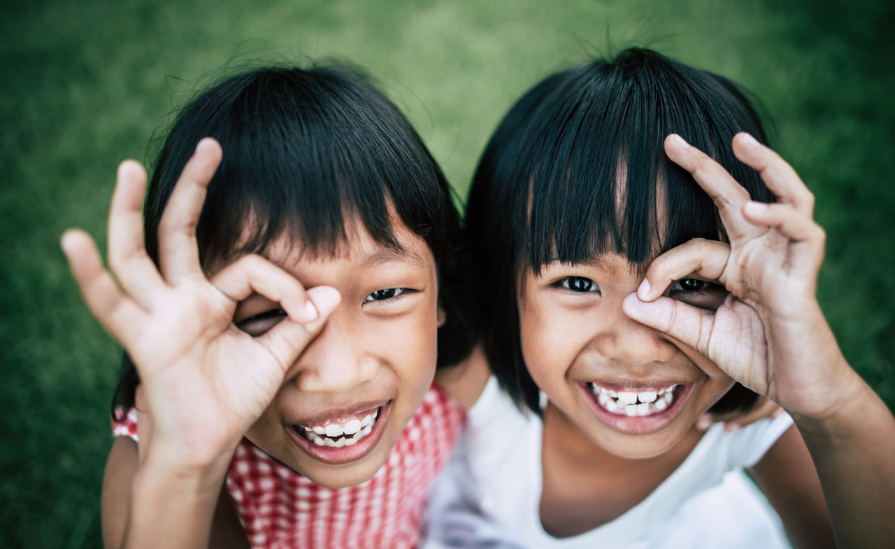 two-little-girls-friends-playing-funny-park.jpg