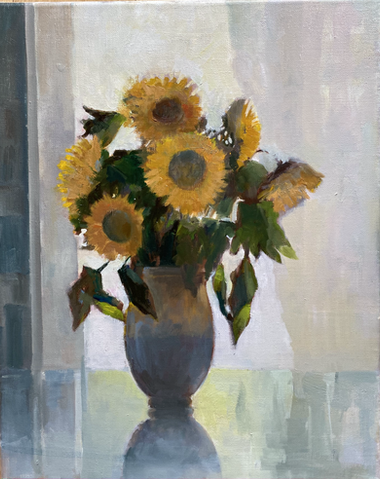 Sunflowers on a glass table