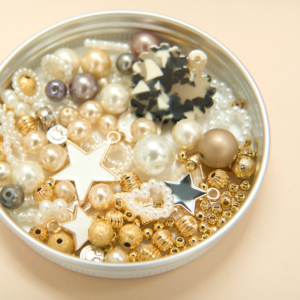 Thumbnail: FAY&MAMIE MORMOR Pearl Beads Necklace DIY Kit Content showing vintage beads pendants stars bows smileys in tin container