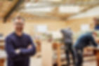three-people-in-a-furniture-workshop-making-bespok-2022-03-04-02-40-04-utc.jpg