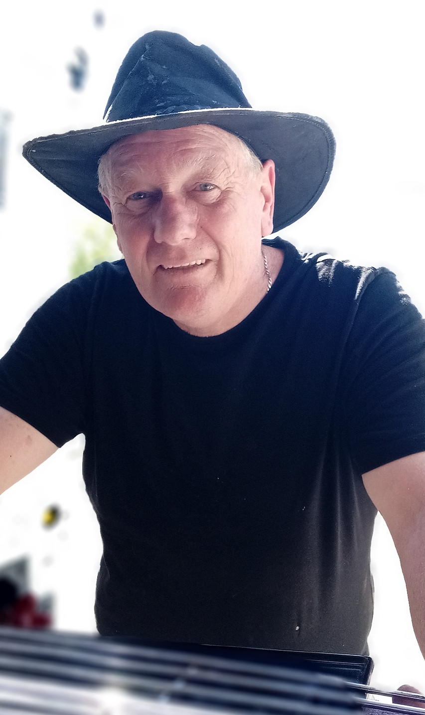 Man in black t-shirt and dark hat