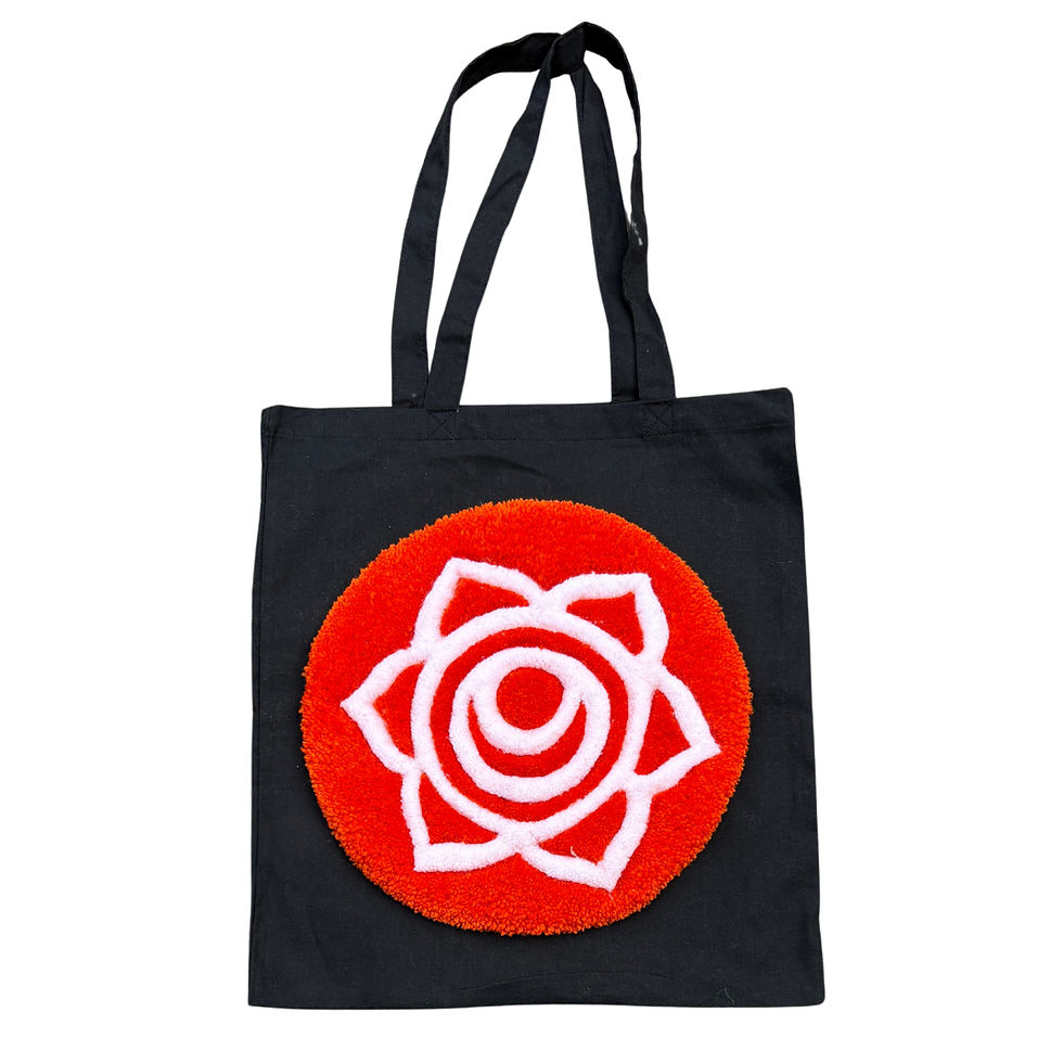 Thumbnail: Hand tufted 33cm diameter circular Sacral Chakra on a black Tote Bag. www.astralthreads.co.uk