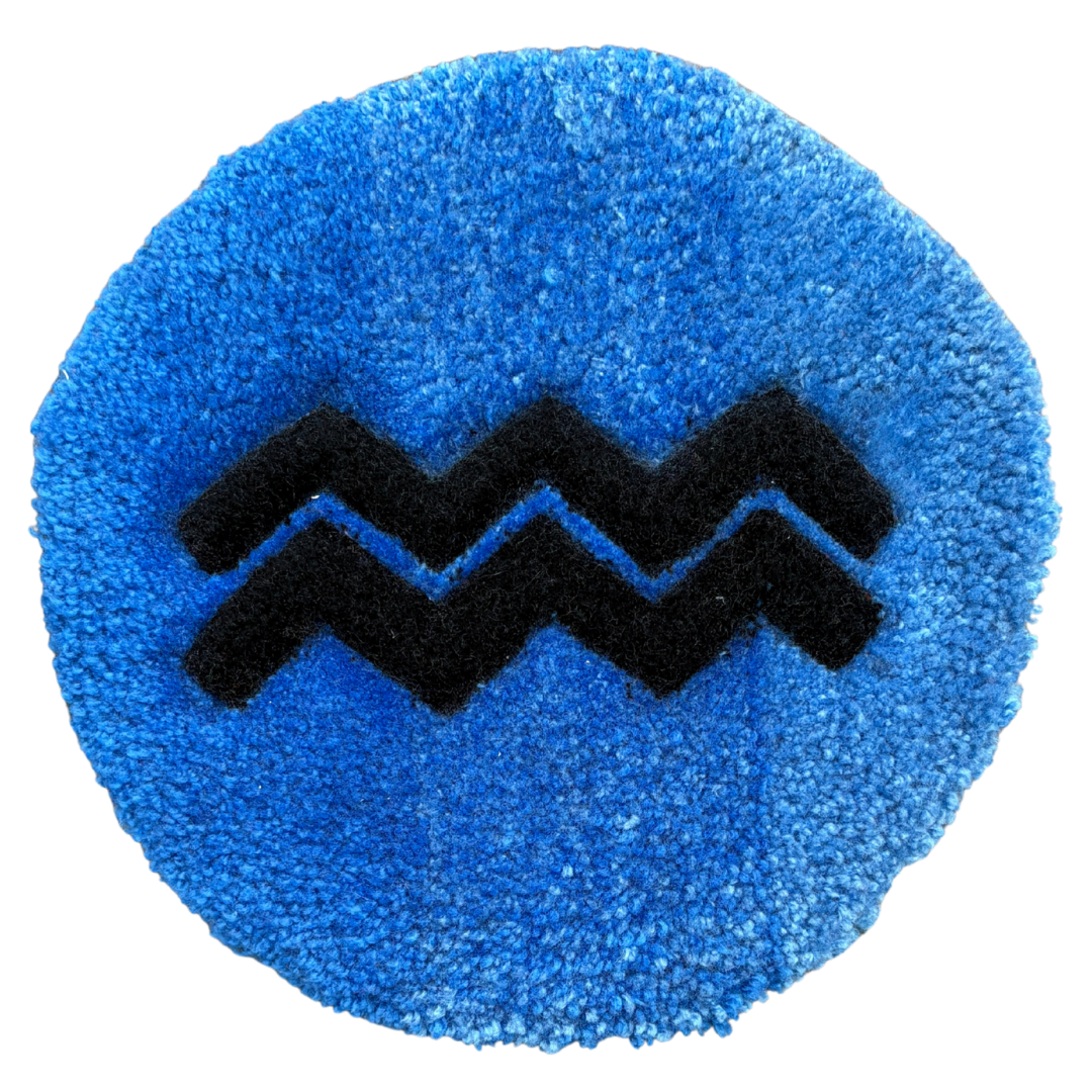 Modern Aquarius water bearer symbol, 33cm diameter hand-tufted astrology art featuring the wavy glyph.