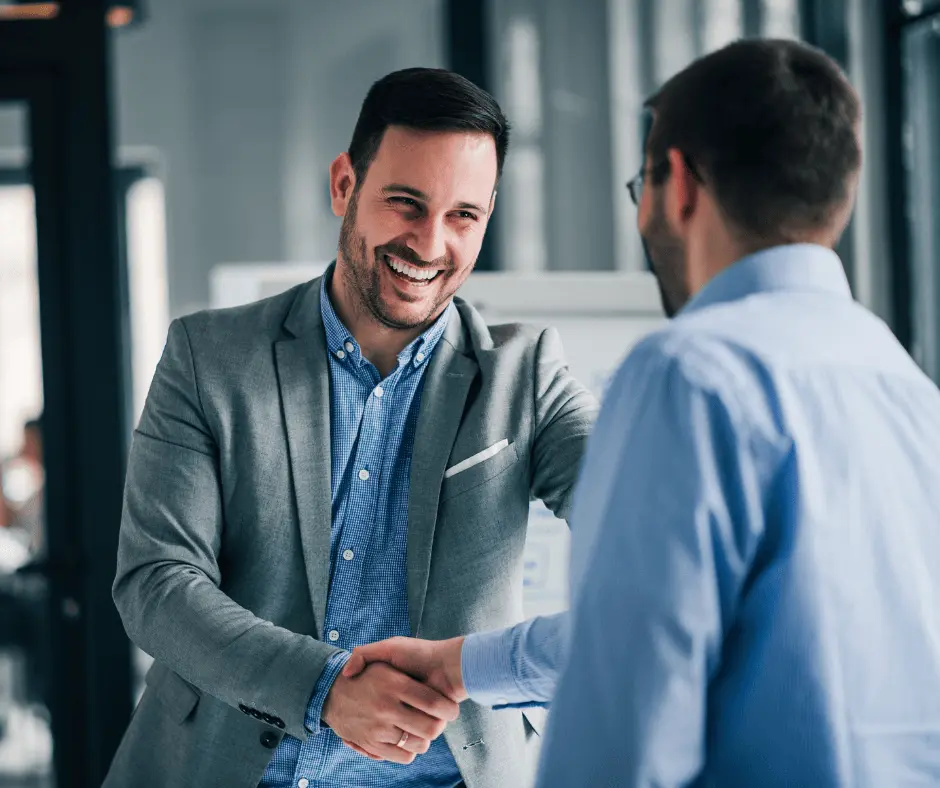 Friendly handshake with co-worker