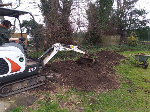 Pile of Earth to Raised Beds