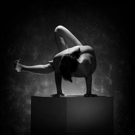 Fine art nude yoga portrait highlighting graceful posture