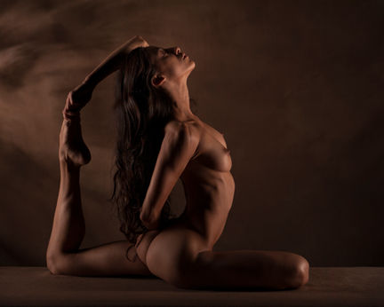 Artistic nude yoga composition emphasizing quiet strength
