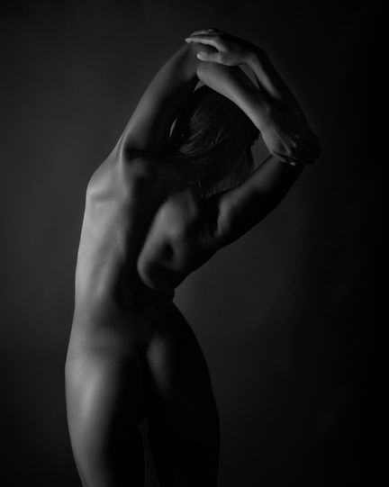 Artistic nude figure study exploring posture and proportion