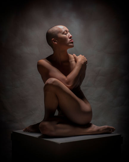 Artistic nude yoga image highlighting flexibility and grace