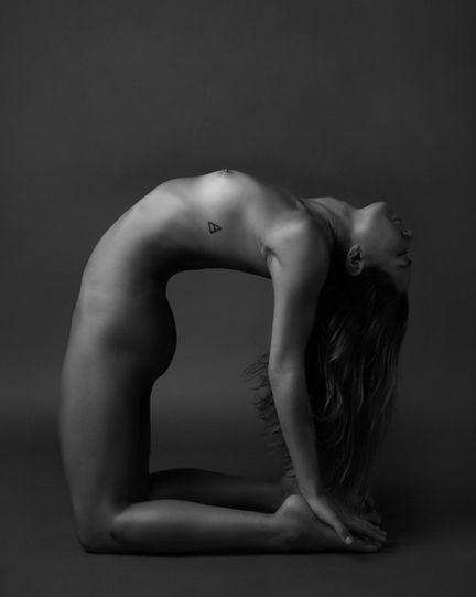 Fine art nude yoga photograph capturing calm breathing posture