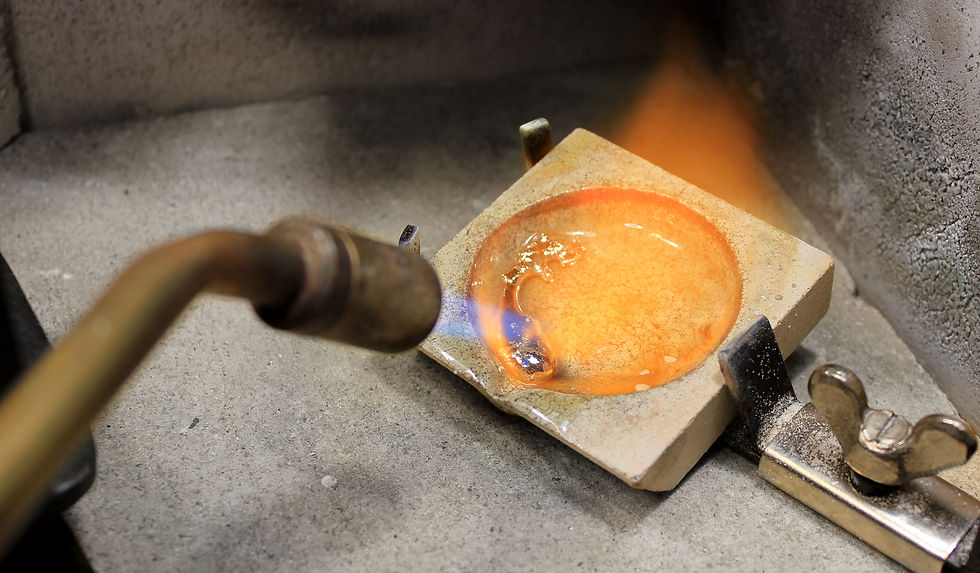 Melting down FairTrade 14k yellow gold to make bespoke wedding rings.