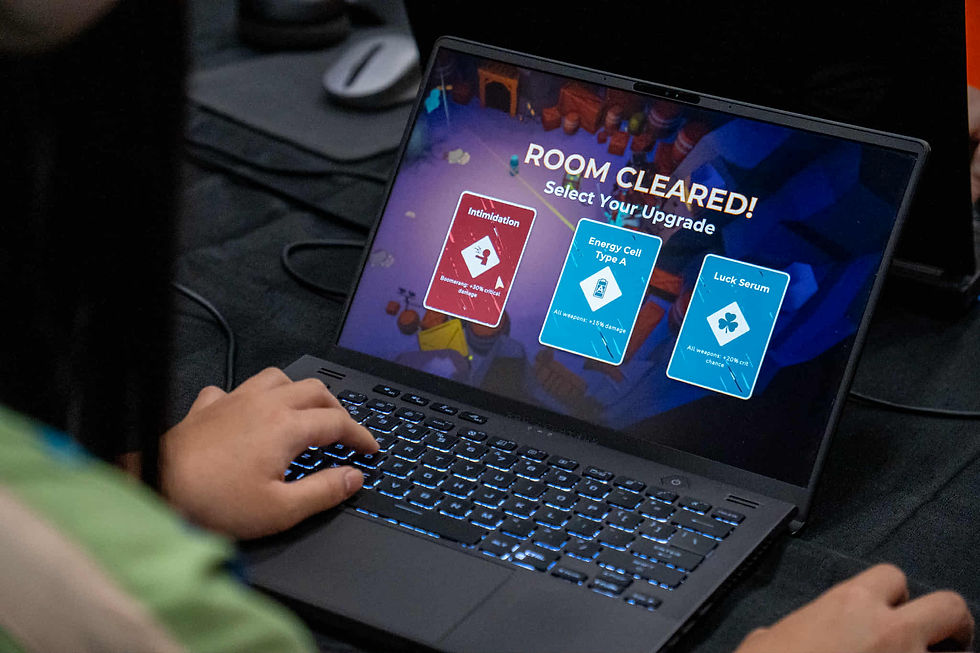 A laptop, with the game Super Safe Spelunking Open. The 'room cleared' screen can be seen.