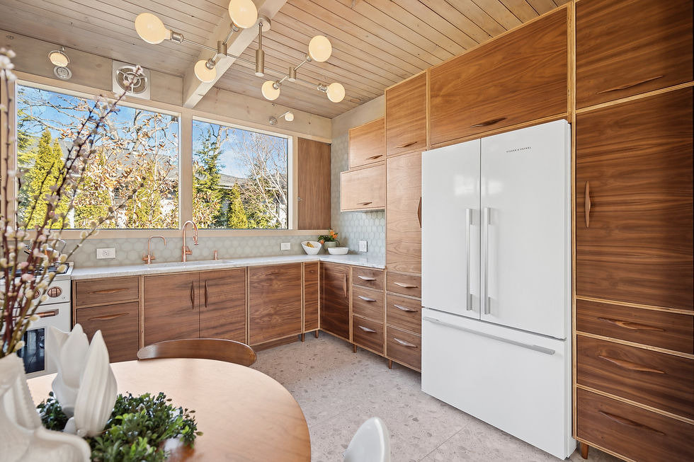Mid Century Modern wood kitchen cabinets with flat-front doors and warm natural finishes
