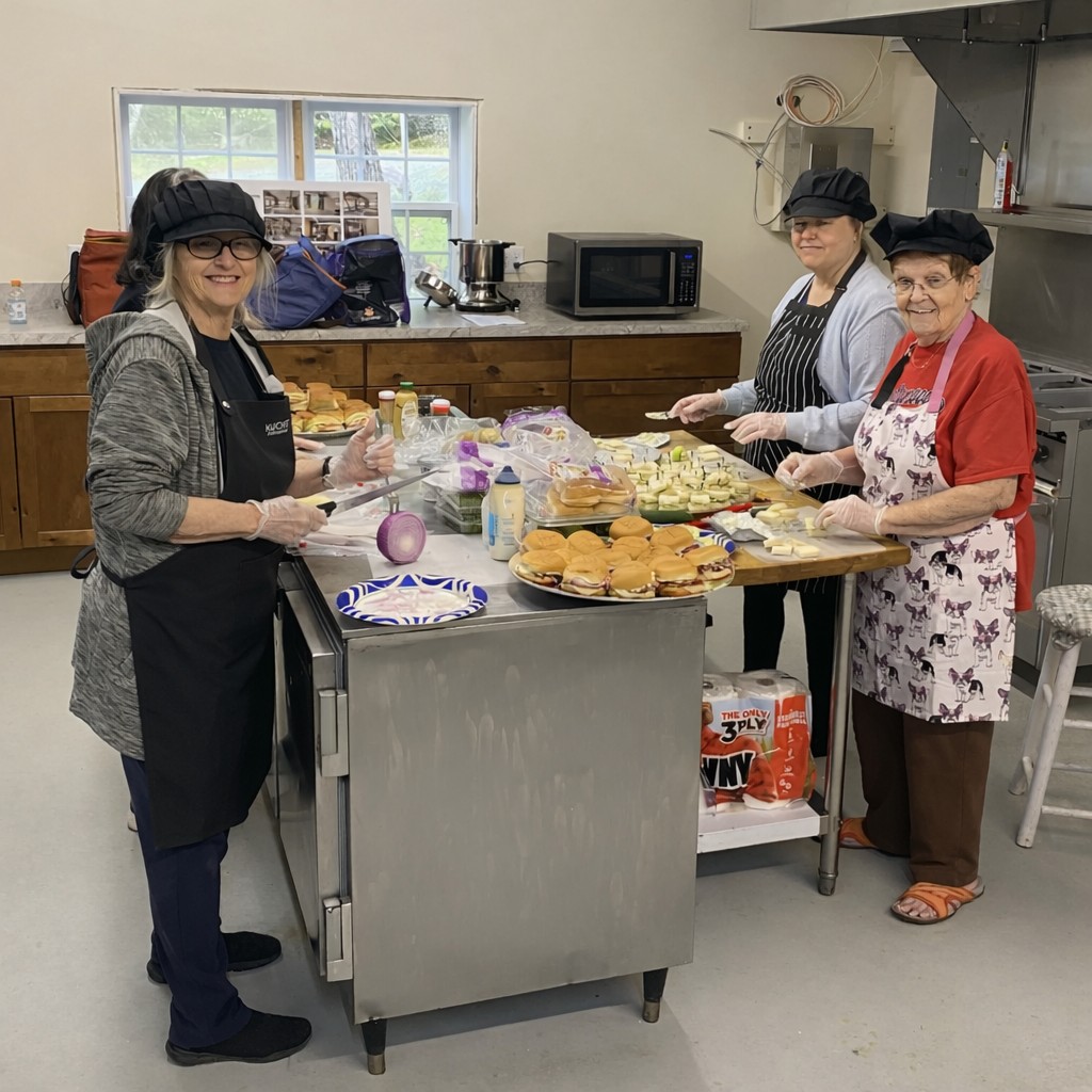 Volunteer team collaborating in the new kitchen.
