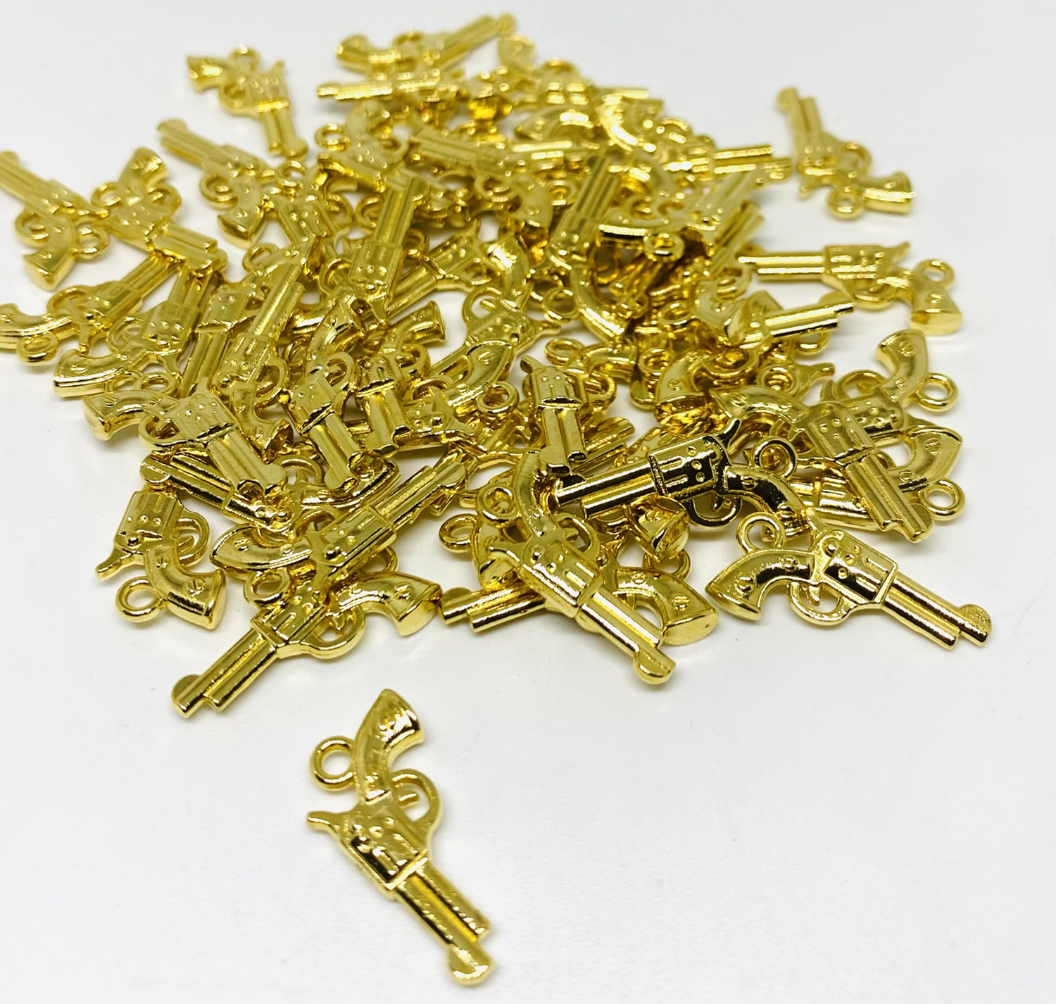 Pistola dije  chapa de oro 24k.