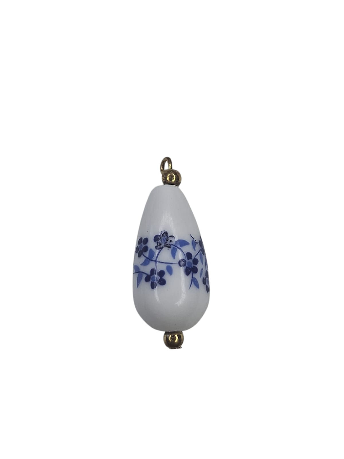 White teardrop ceramic pendant with blue floral design and gold loops.