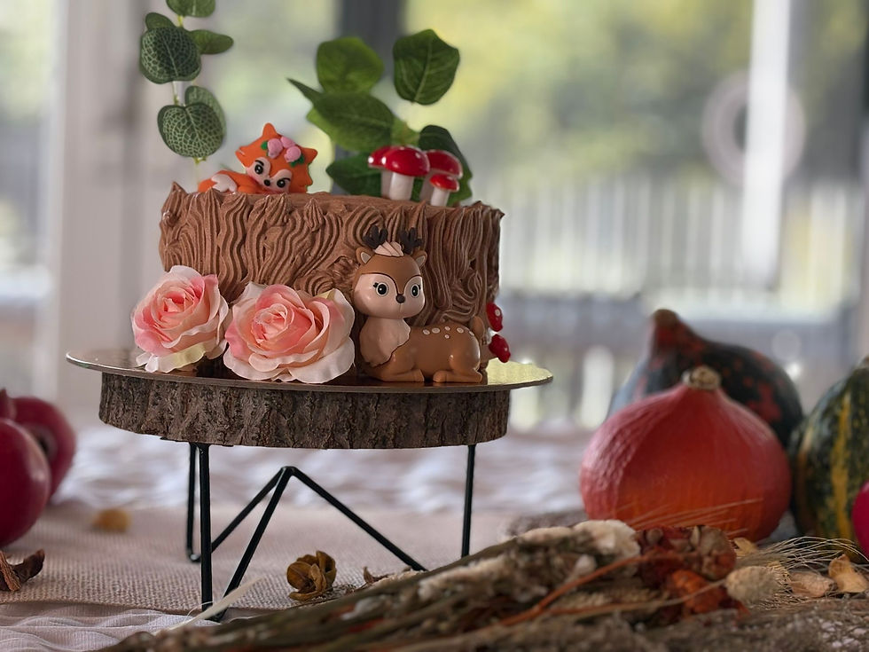 Thumbnail: Woodland-themed cake with edible deer figurine, roses, and red mushrooms on top