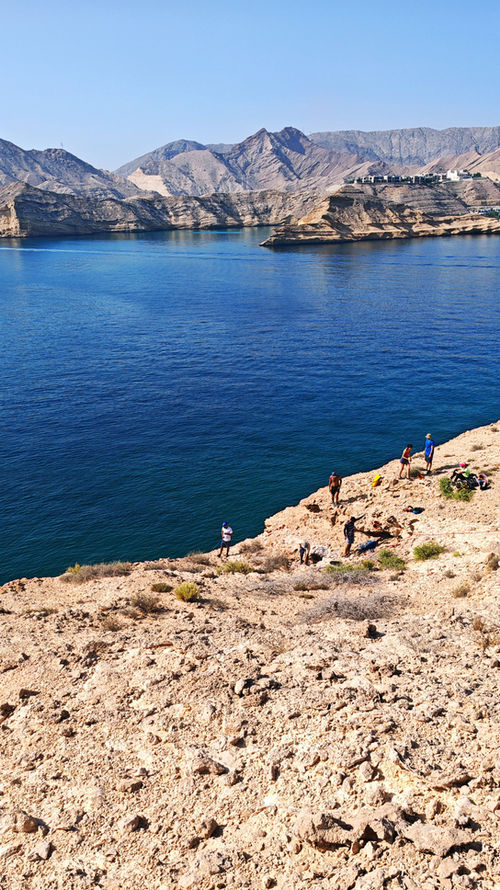 Panoramic view of Qantab Island and the turquoise coast near Muscat during a boat and abseiling tour in Oman