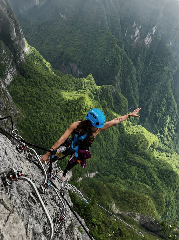 Climber descending a steep rock face during a Jabal Samhan abseiling tour in Dhofar