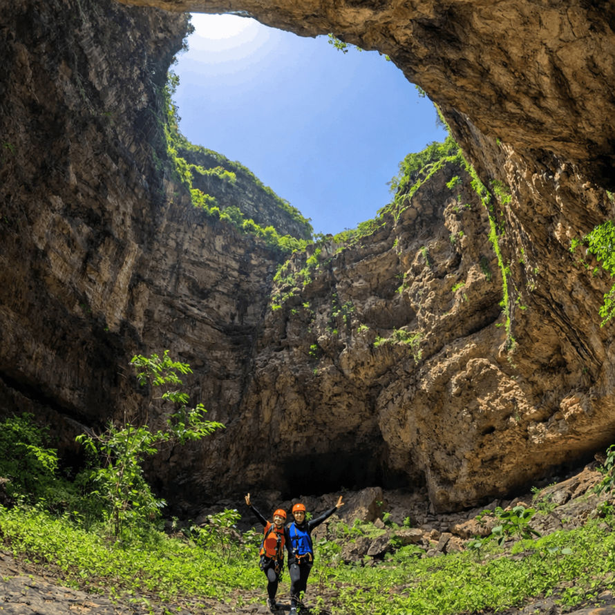 Traveler standing inside a dramatic rocky canyon in western Salalah, Dhofar