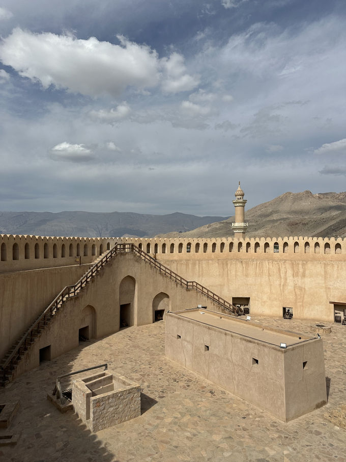 View across the historic rooftops and defensive walls of Nizwa Fort
