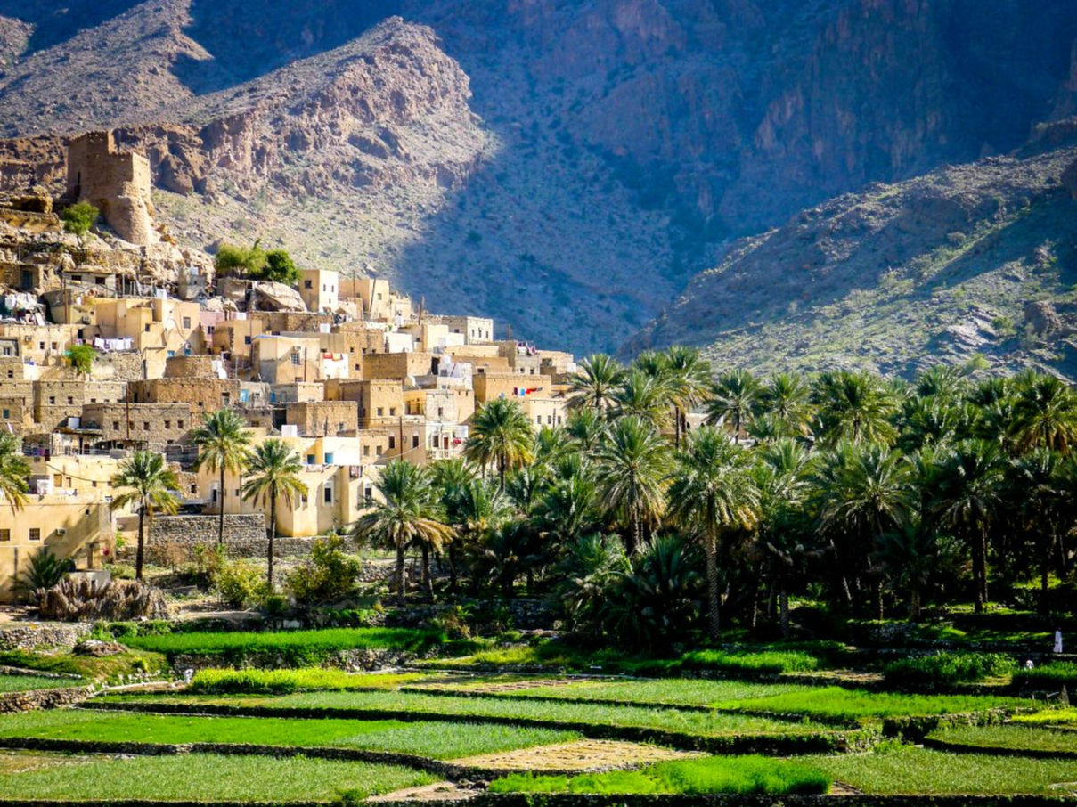 Traditional mountain village and green terraces in the Hajar Mountains