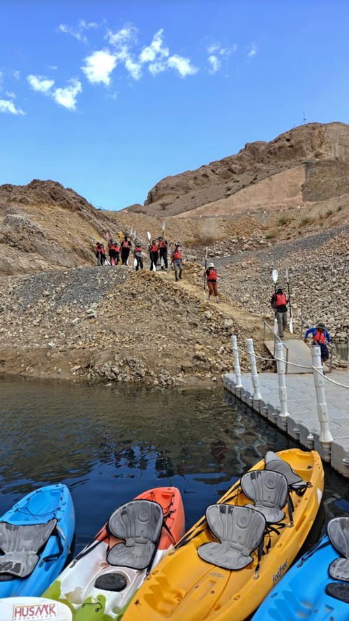 Adventure group arriving at the Wadi Dayqah kayak and via ferrata starting point in Oman