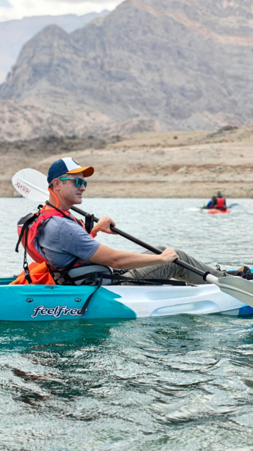 Traveler kayaking on Wadi Dayqah Reservoir during a three-hour adventure tour in Oman
