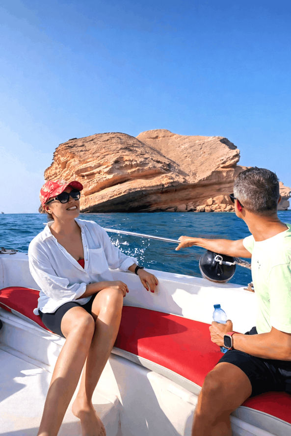 Travelers enjoying a speedboat ride to Al Fahal Island during a snorkeling and island hike tour