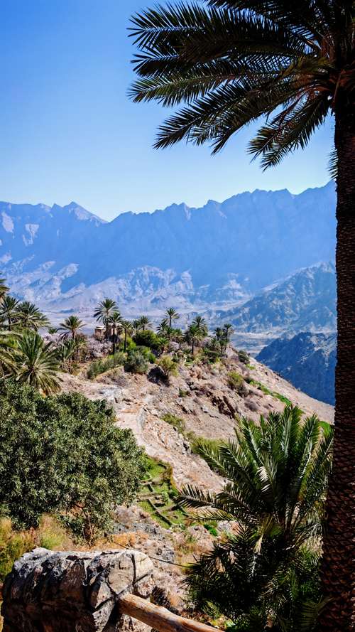 Panoramic view of Wakan Village and the rugged Hajar Mountains