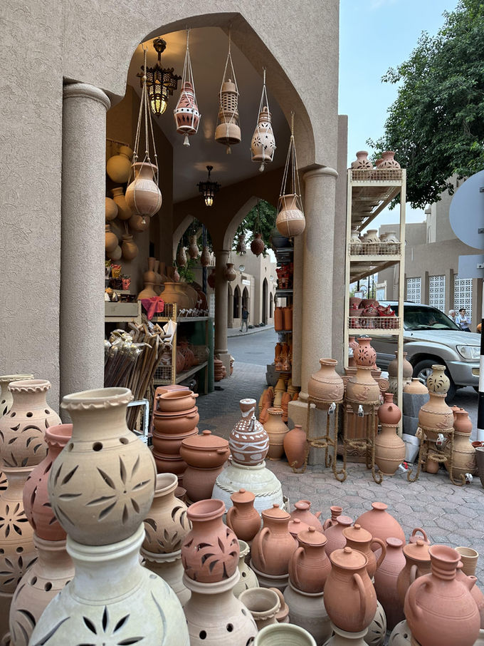 Traditional pottery and handicrafts displayed at Nizwa Souq