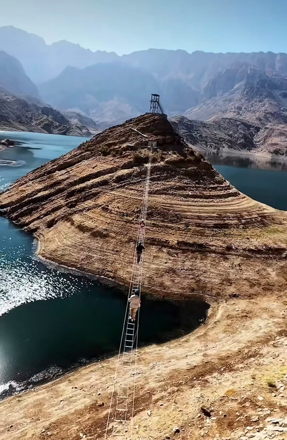 Via ferrata and hanging bridge route above the turquoise water of Wadi Dayqah Dam