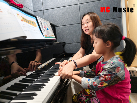 One of our teachers correcting her student's fingering.
