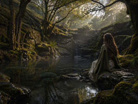 Irish-Celtic image of a sacred spring or deep river source in an ancient mist-filled grove, with mossy stones, reflective water, and a quiet feminine witch presence, expressing Danu, origin, nourishment, and the hidden source wisdom of Irish mythology within a mystical land-based spiritual atmosphere.