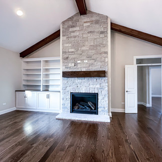 stone fireplace with rustic wood mantel
