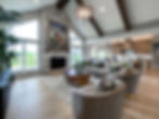 great room with 15 foot vaulted ceilings and wood beams
