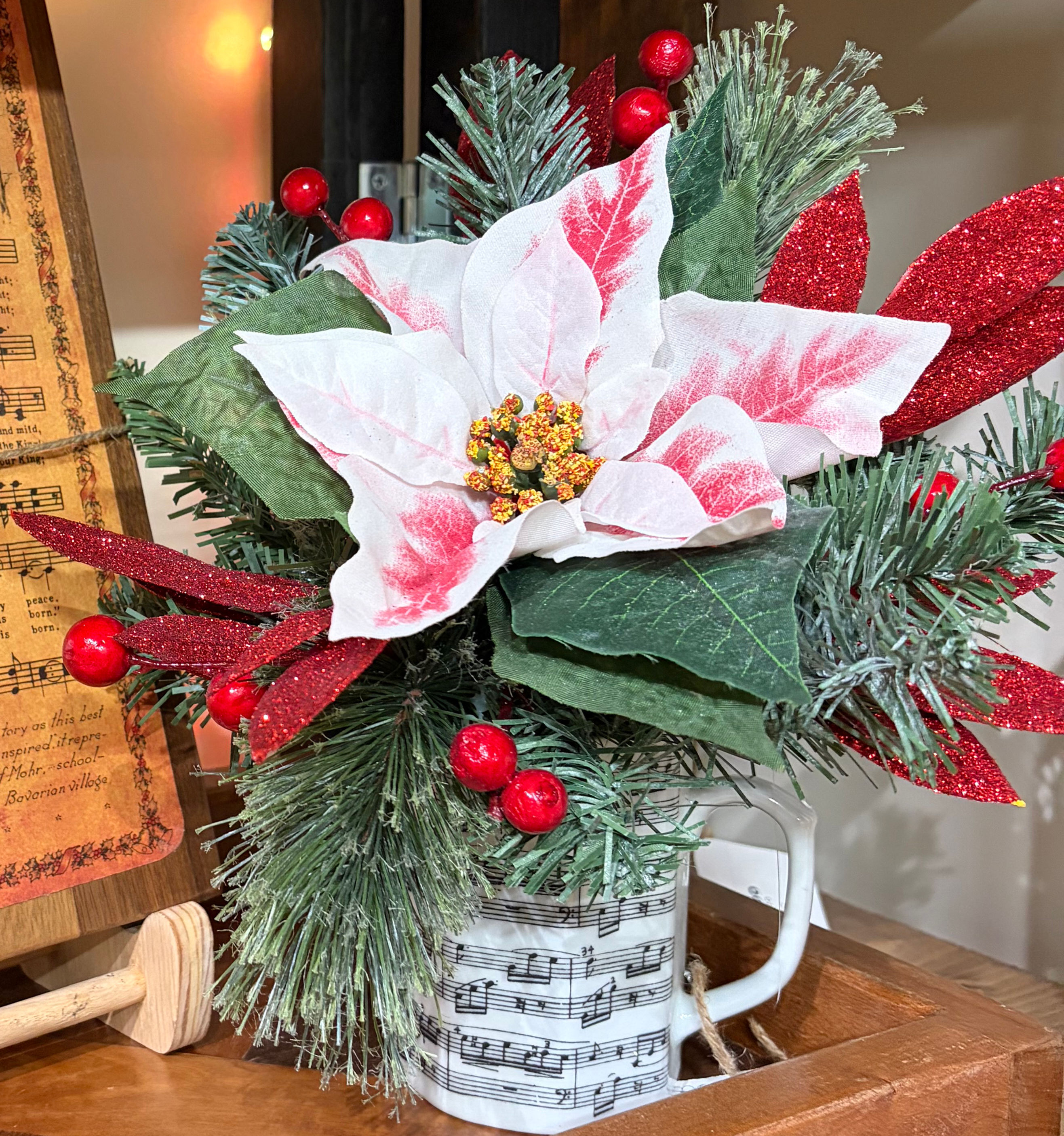 12" Musical Mug Christmas Arrangement with Red & White Poinsettia