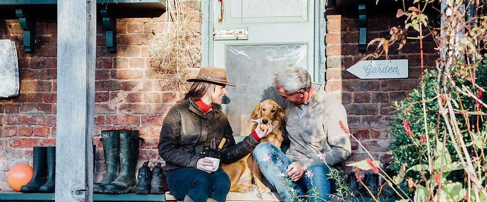 Jenny and Tom with their dog at the laundry garden